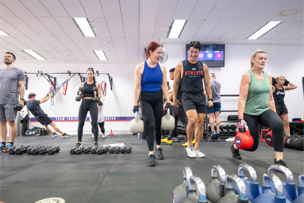 Participants in a high-intensity F45 workout session at the Downtown Los Angeles studio, showcasing functional and HIIT training.