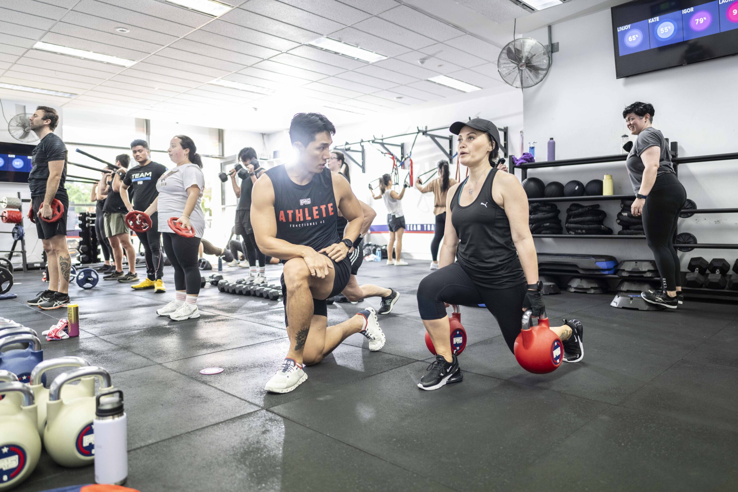 Participants engaging in a high-energy workout session at F45 Downtown Los Angeles, showcasing functional training in action.