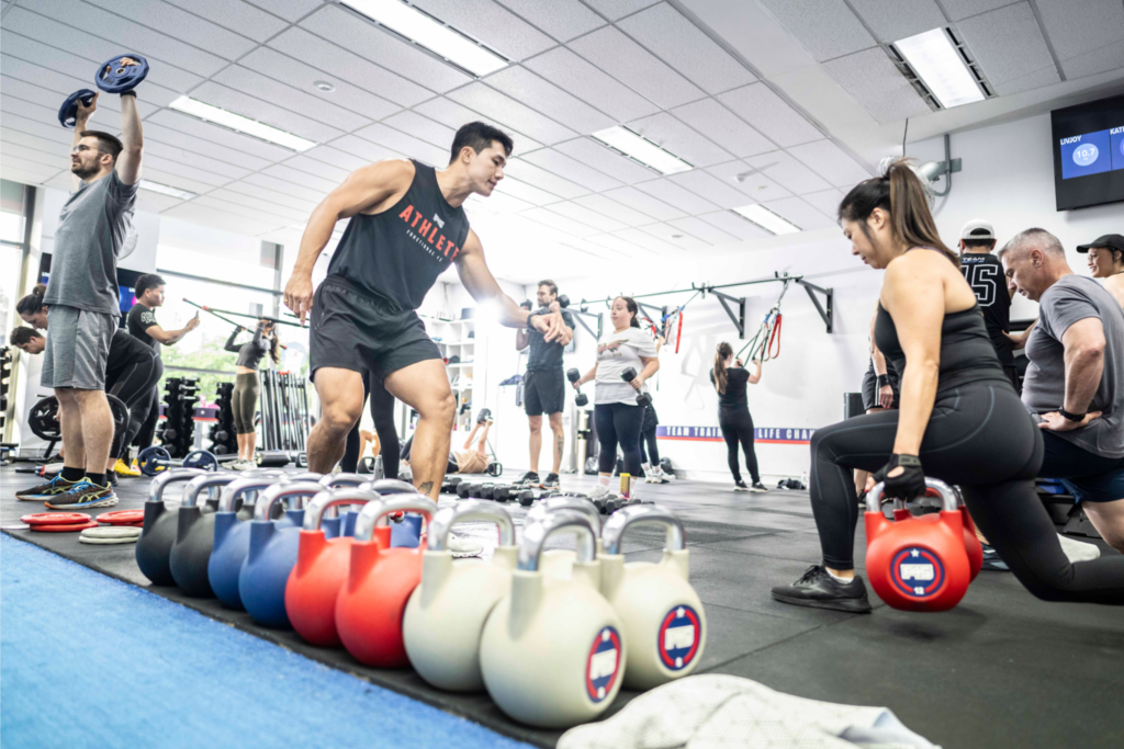 People of all fitness levels engaging in a high-energy HIIT workout at F45 Downtown Los Angeles.