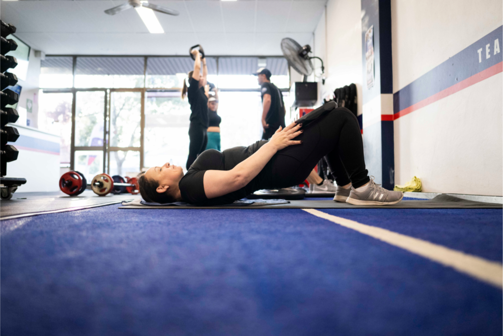 F45 trainer guiding beginners through their first workout at F45 Downtown Los Angeles, highlighting a welcoming and supportive environment.