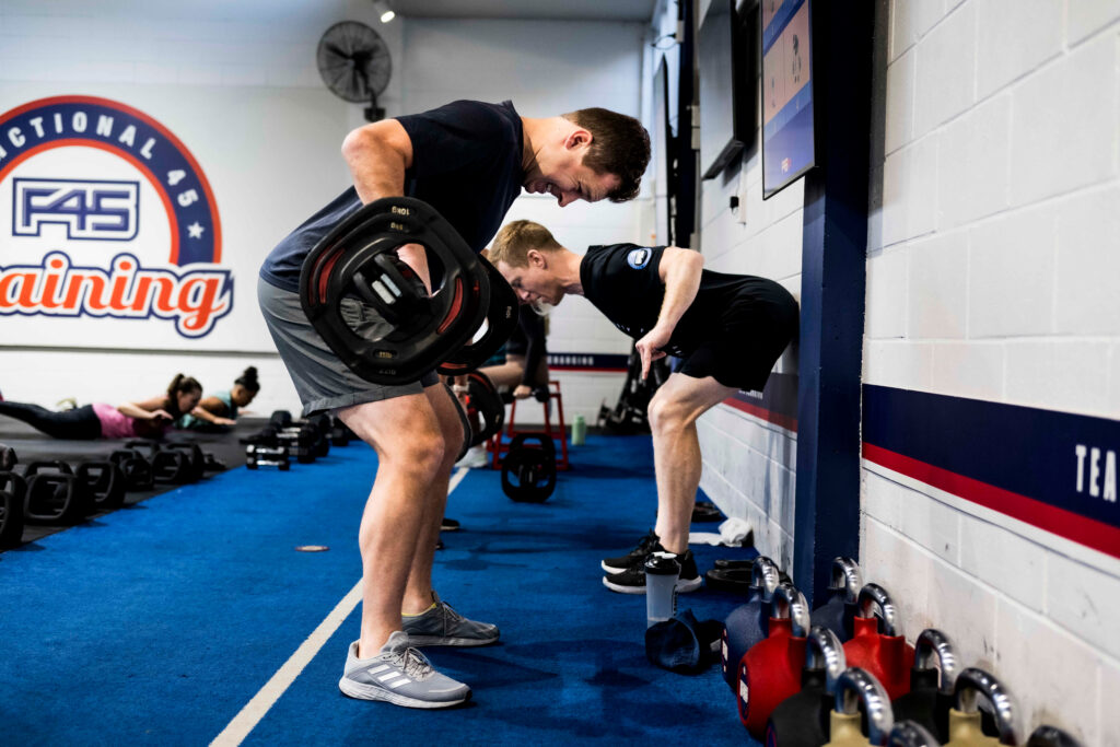 Inside F45 Downtown LA, members engage in high-intensity functional training workouts
